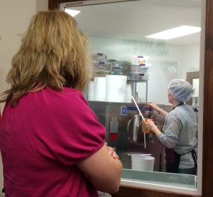 Badger NAMA members watch as milk from the farm is made into ice cream at Kelley Country Creamery